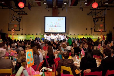 Other decorative elements in the gym included dozens of pink and orange balloons, chairs in a variety of colors, and tablecloths splattered with paint.