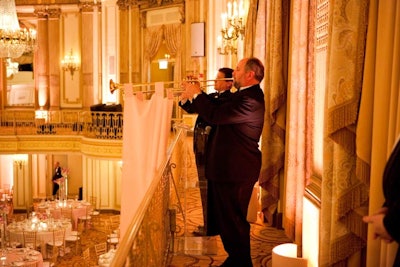 From the balcony, trumpeters played on instruments adorned with long pink sashes. 'It was all about fun and fanfare,' event designer Jeffrey Foster said.