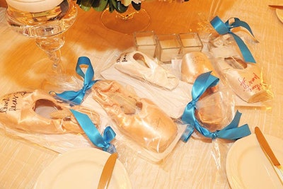 Guests found signed ballet slippers at their place settings.