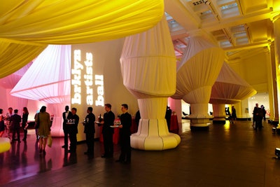 To change the shape of the museum's Great Hall for the event's cocktail reception, Brooklyn-based Situ Studio fabricated a site specific installation of fabric canopies.