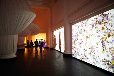 The reception also exhibited work by video artist and designer Sean Capone, a large-scale, animated projection that covered one wall with moving floral patterns.