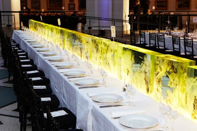Designed by artist Dustin Yellin and titled 'The Strangers,' transparent blocks with yellow-green coloring formed a striking look for one table.