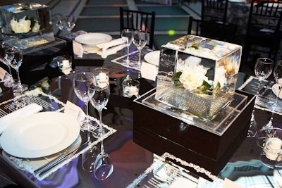 The details in Duravecevic's design included a table cloth of mirrored Mylar printed with pages from Walt Whitman's Leaves of Grass poetry collection and flowers embedded in blocks of ice.