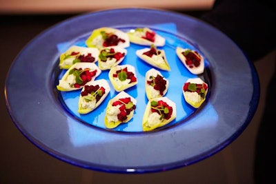 Presented on colorful dishes, the reception's passed hors d'oeuvres from Restaurant Associates included spiced chicken samosas with a cilantro yogurt dip, fried truffle mac 'n' cheese cubes, and Belgian endives with beets, apples, and Gorgonzola.