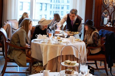 The event drew about 75 guests, many of whom wore hats to get in the spirit.