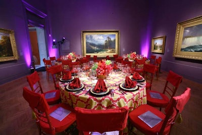 Deep red chairs and mustard yellow linens complemented the bright purple walls in one of the galleries.