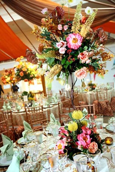 Jack Lucky Floral Designs took inspiration for each table's centerpieces from the colors of the surrounding decor and incorporated complementing flowers.
