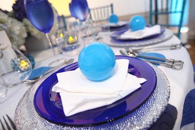 Occasions continued the polka-dot theme on the second floor with blue plastic balls on each plate.