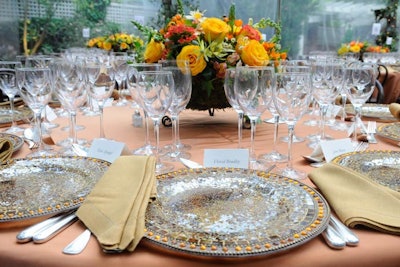 Mosaic chargers and Ociana Group floral arrangements topped the tables at David Bradley's Friday night dinner.