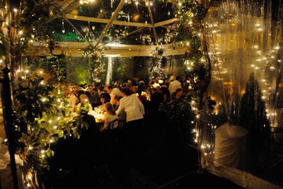 Once the sun set, David Bradley's dinner tent from Loane Brothers twinkled with lights, candles, and foliage.