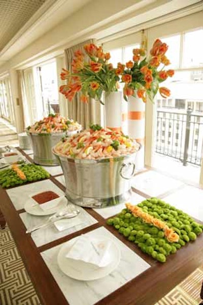 Eve Suter was responsible for the decor and brightly hued floral arrangements at the Thomson Reuters/The McLaughlin Group brunch on Sunday.