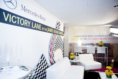 Mercedez-Benz dubbed the area the 'Victory Lane.' A racetrack-printed carpet and racetrack graphics added to the effect.