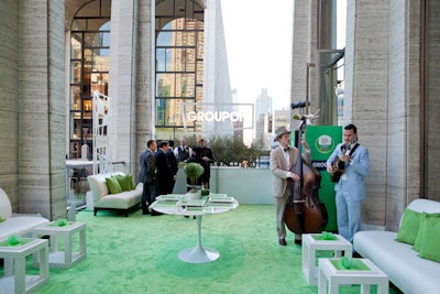 Groupon's lounge on the balcony included live music, lounge seating, plush carpeting, cupcakes, and a bar.
