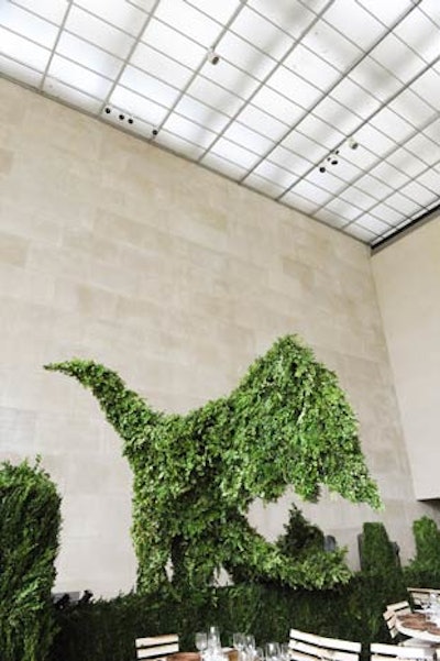 After cocktails in the Petrie Court, dinner guests entered the Temple of Dendur, which was transformed into a English garden for the night. Eight-foot-tall boxwood hedges and two 10-foot-tall bird-shaped topiaries helped set the scene.