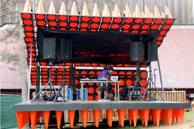 Between bands' sets on the main stage, DJs performed at a booth in the V.I.P. area outfitted with orange traffic cones.