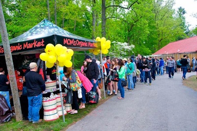 Sponsors like Mom's Organic Market set up tents with organic and health food giveaways along the walkways surrounding the main lawn of the venue.