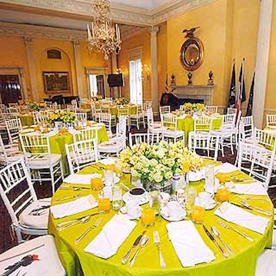 Matthew David Events decorated tables with daffodil and viburnum centerpieces that incorporated pages from New York newspapers and magazines. (Photo courtesy of Kevin McCormick Photography)