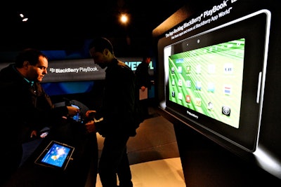 Staffers inside the truck help guide visitors through the new tablet's features, including the different gestures needed to control the system and the array of apps available.