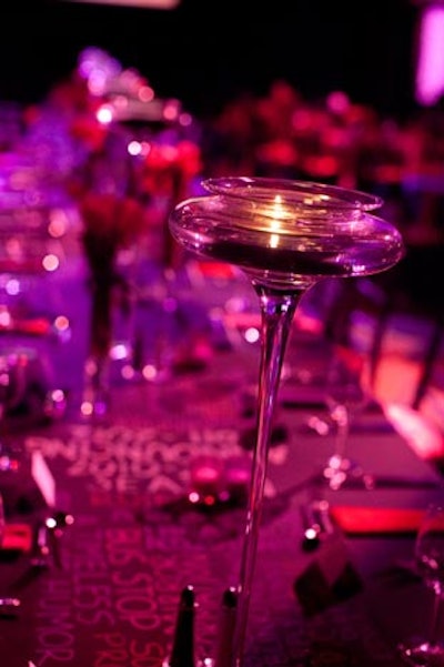 Tall crystal candleholders illuminated the long tables.