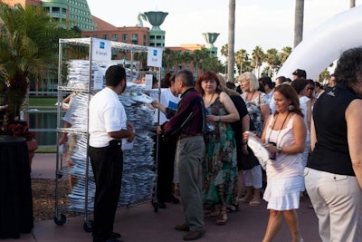 As guests arrived at the beach party, they replaced their shoes with flip-flops bearing the American Express logo.