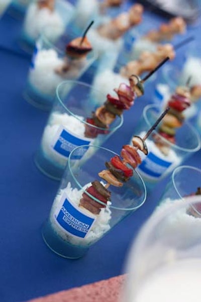 Chicken and vegetable kabobs were presented in American Express cups.