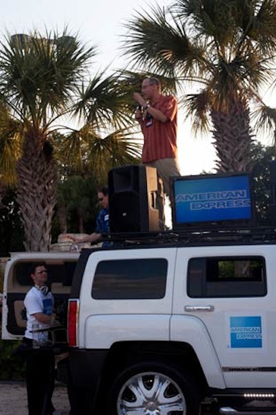 Pat Corbett, American Express vice president for global supplier relations, spoke to the crowd from atop the Mix on Wheels hummer that served as the DJ booth.