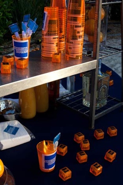 The American Express logo showed up everywhere at the party, including on cups, swizzle sticks, and lighted ice cubes.