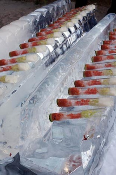 Food stations included tubes of shrimp cocktail presented on a block of ice.