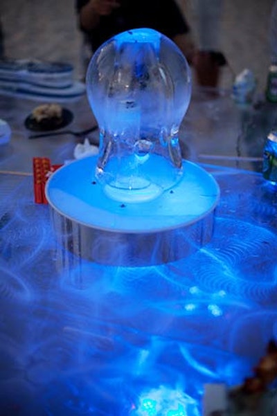 To go along with the 'Fire and Ice' theme, candle-filled ice centerpieces topped some of the clear acrylic tables from Ice Magic.