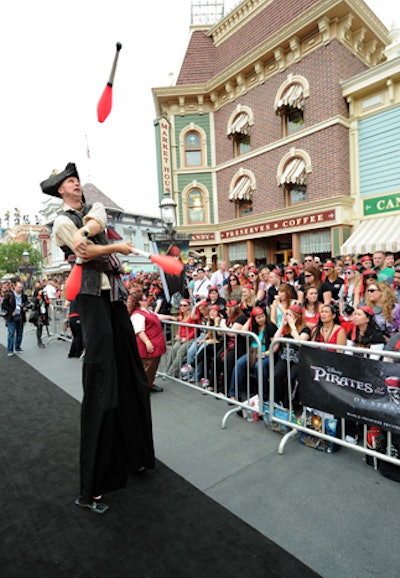 A stiltwalker was among the performers on the arrivals carpet.