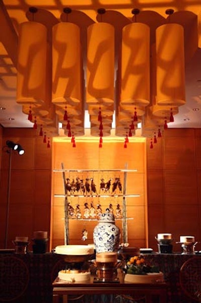 Peking ducks dangled from a bamboo display in the lower level’s Peking Duck Gallery, where 10 chefs carved traditional Peking duck for queues of guests.