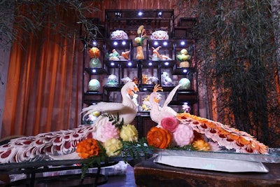 Near the pagoda on the lower level, Los Angeles-based carver Jimmy Zhang brought in samples of elaborate fruit and vegetable carvings of birds, seahorses, and flowers. Zhang and an assistant demonstrated fruit and vegetable carving during the event.