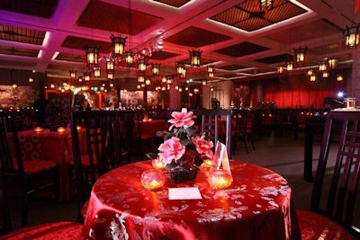 Glass bonsai trees and red Chinese fabric tablecloths topped the tables in the ballroom. A local dealer specializing in Chinese antiques and reproduction rented out furniture for the event.
