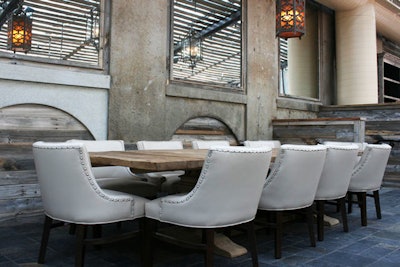 White leather furniture and lanterns also play into the decor.