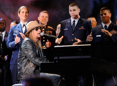 To emphasize its new program to provide aid to New York City's veterans and their families, Robin Hood brought Kid Rock and 300 uniformed military personnel to the stage to perform 'Care.'