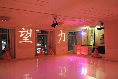 Chinese symbols for 'hope' and 'strength' illuminated the walls surrounding the dance floor.