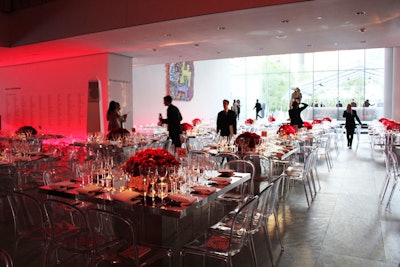 Red was the dominant color in the dining room, with red lights and floral arrangements accented by clear chairs and mirrored tables. The uncluttered look matched the clean architectural design of the museum's interior.