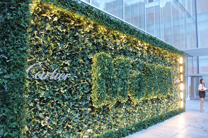 After much research, the event's organizers chose to create a striking topiary at the entrance to the garden, incorporating MoMa's logo alongside sponsor Cartier's into a simple backdrop for the arrivals area.