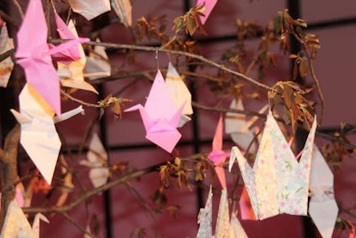 The paper cranes on the the tree continued the soft pink palette of the event.