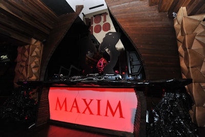 A Maxim logo glowed in red.