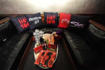 Logoed throw pillows and magazines dotted seating groups.