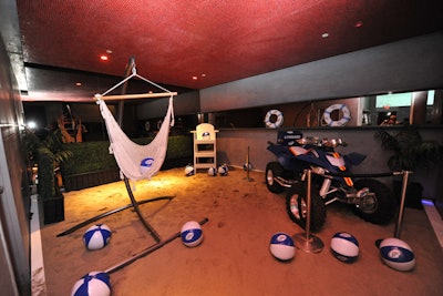 A beach lounge had projections of rolling waves, real sand, a lifeguard tower, hammock, and Miller-branded ATV.