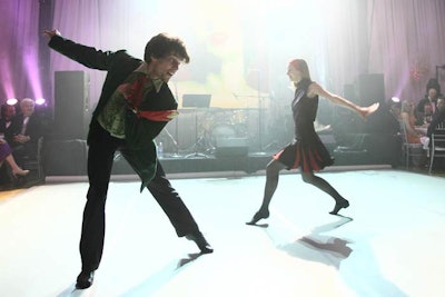 Company dancers performed excerpts from its Rock & Roll show before dinner.
