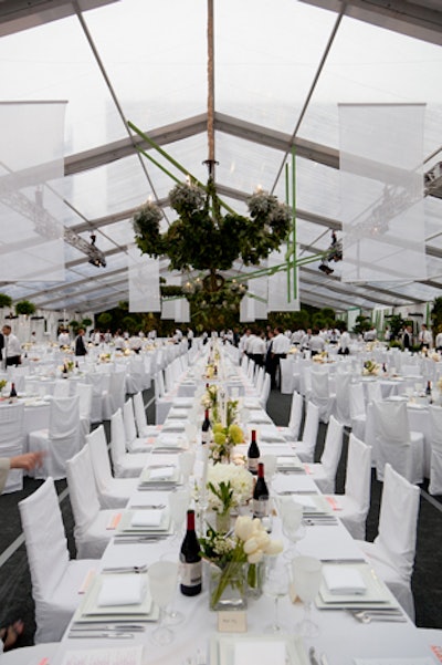 Also hanging overhead were five wrought-iron chandeliers covered with leafy plants, hundreds of Boston ferns, and a dozen spheres of foliage.