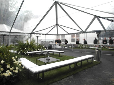 As the cocktail hour was set up in the same area as the after-party, the setting was designed to look appropriate for post-dinner sponsor Calvin Klein, with sod laid in a grid pattern, minimalist park-bench-style seating, and simple white planter boxes of rosebushes.