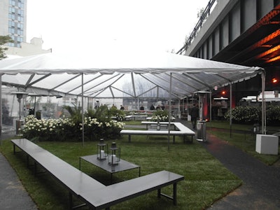The area for the predinner reception is used by the nonprofit to hold construction materials, so the producers created walls by stacking 23 one-and-a-half-ton steel beams.