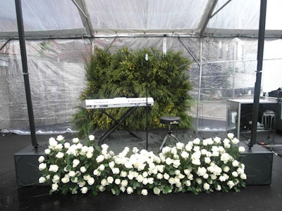 More foliage and roses covered the small stage.