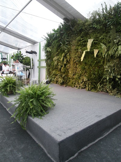 Another wall of foliage served as the backdrop for the stage in the dinner area.