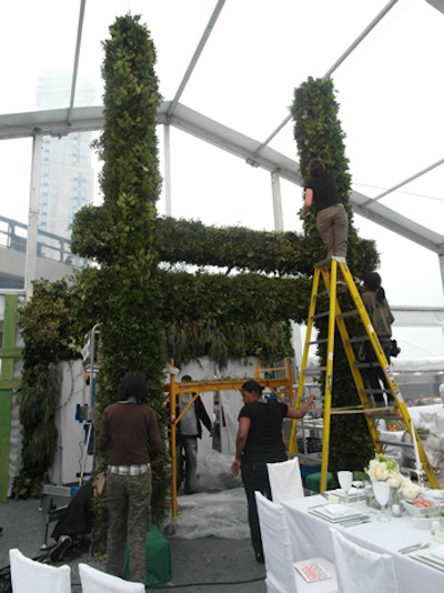 The entrance to the tent was marked by a 25-foot-tall topiary in the shape of an H, part of the nonprofit organization's logo.