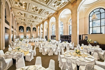 The impressive Grand Banking Hall boasts a 100-foot-long bar modeled after the bank's original teller counter.